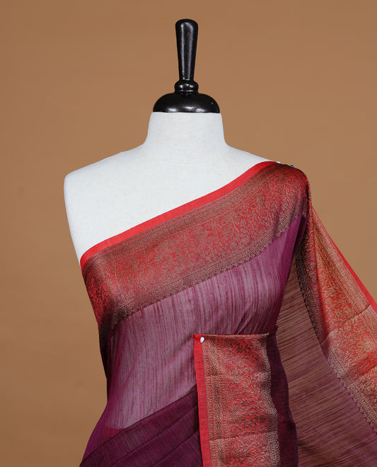 Maroon colour Semi linen saree featuring Elegant plain body, complemented by contrast Red colour With Antique zari border, paired with matching blouse piece.