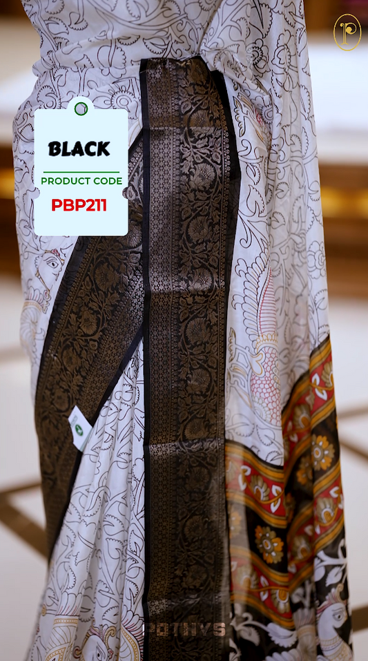 White colour Kalamkari saree featuring intricate prints, paired with a striking black and golden traditional border & The multicolor Kalamkari printed pallu adds vibrant charm, perfectly matched with a coordinating blouse.