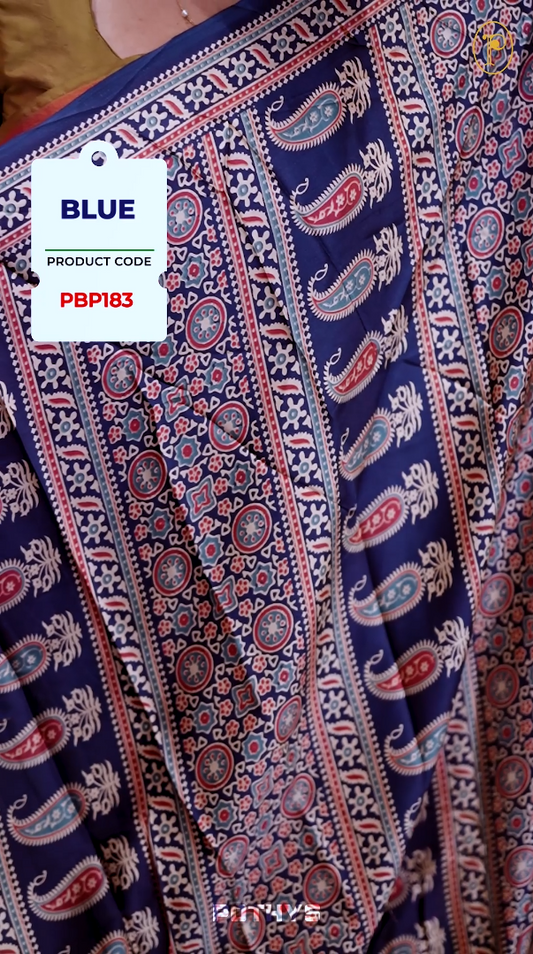 Blue Semi modal silk saree featuring traditional Ajrakh print with intricate motifs and contrast borders, paired with a perfectly matching blouse & A timeless piece blending heritage with grace.
