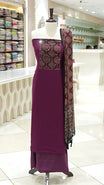 Dark purple Georgette salwar material featuring Ajrakh print with mirror work on the yoke, paired with Ajrakh printed dupatta with mirror detailing and plain bottom.