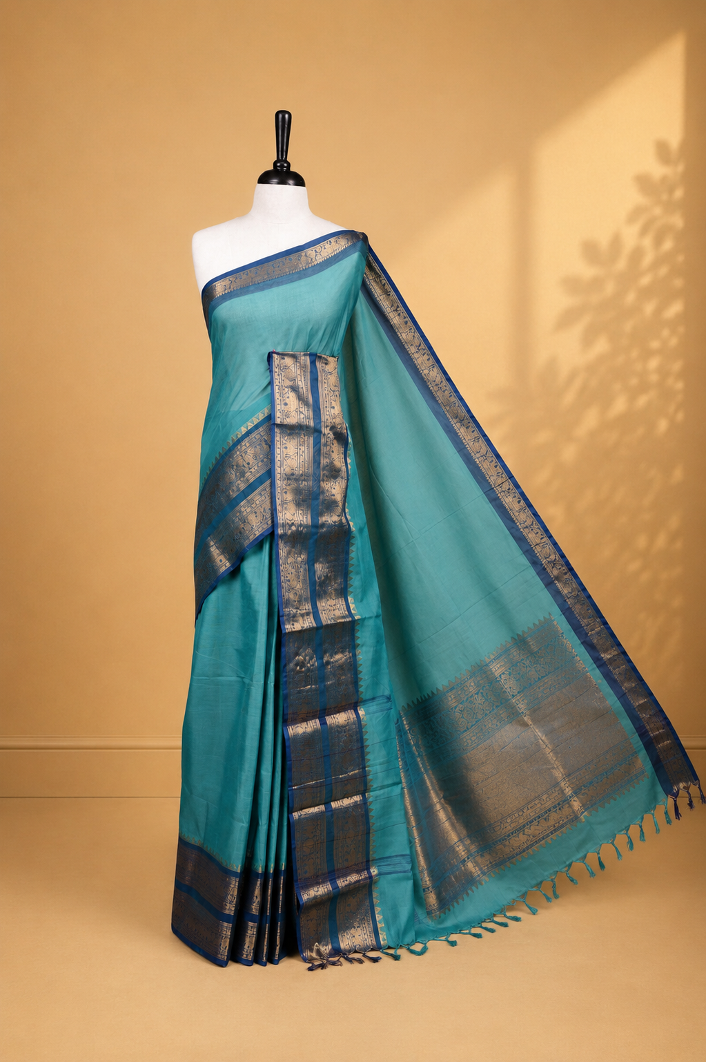Aqua colour Chettinad cotton saree featuring Elegant plain body, complemented by contrast Teal colour with Gold zari border, paired with matching blouse piece.