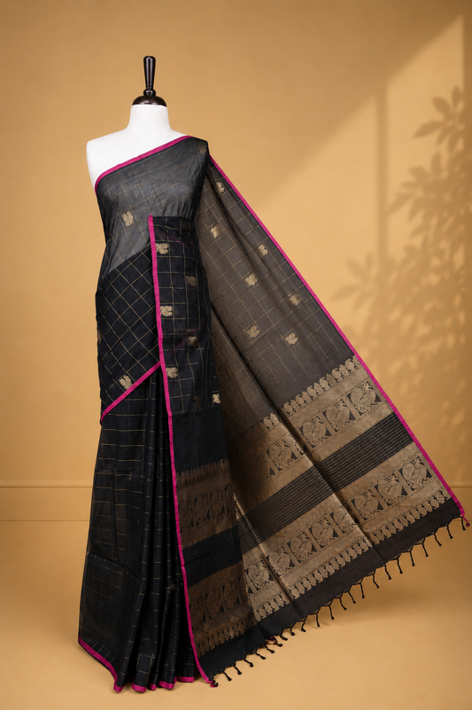 Black colour chettinad cotton saree featuring Gold zari check with Peacock motifs on body, complemented by Magenta colour piping border, paired with matching blouse.