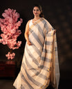 Pink & Light grey dual colour Poly cotton saree featuring Stripped design body, complemented by kasavu border and pallu Finished with elegant tassels, comes with matching blouse piece.
