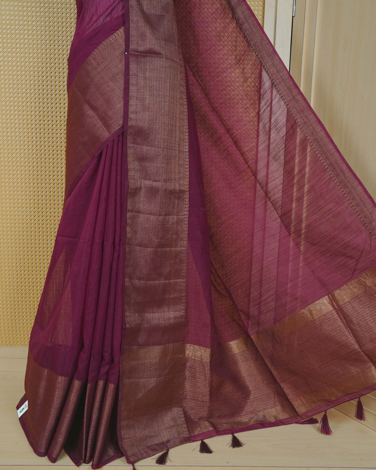 Wine colour semi linen saree plain body, contrast self colour gold zari detailed border, grand pallu comes with matching blouse piece