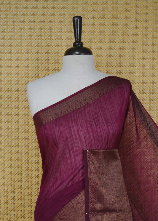 Wine colour semi linen saree plain body, contrast self colour gold zari detailed border, grand pallu comes with matching blouse piece