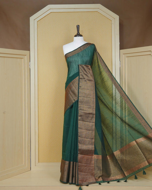 Dark green colour semi linen saree plain body, contrast self colour gold zari detailed border, grand pallu comes with matching blouse piece