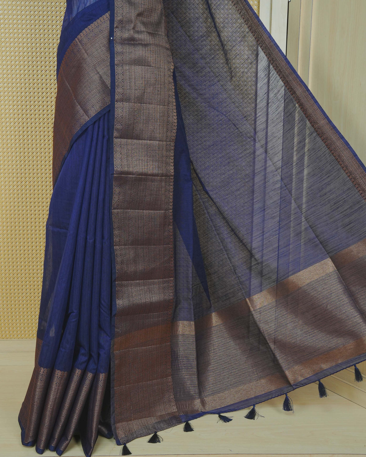 Dark navy blue colour semi linen saree plain body, contrast self colour gold zari detailed border, grand pallu comes with matching blouse piece