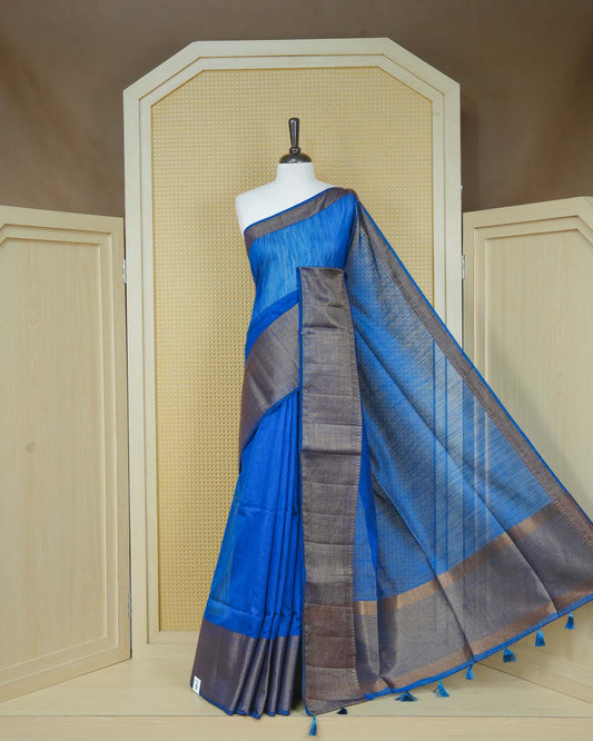 Blue colour semi linen saree plain body, contrast self colour gold zari detailed border, grand pallu comes with matching blouse piece