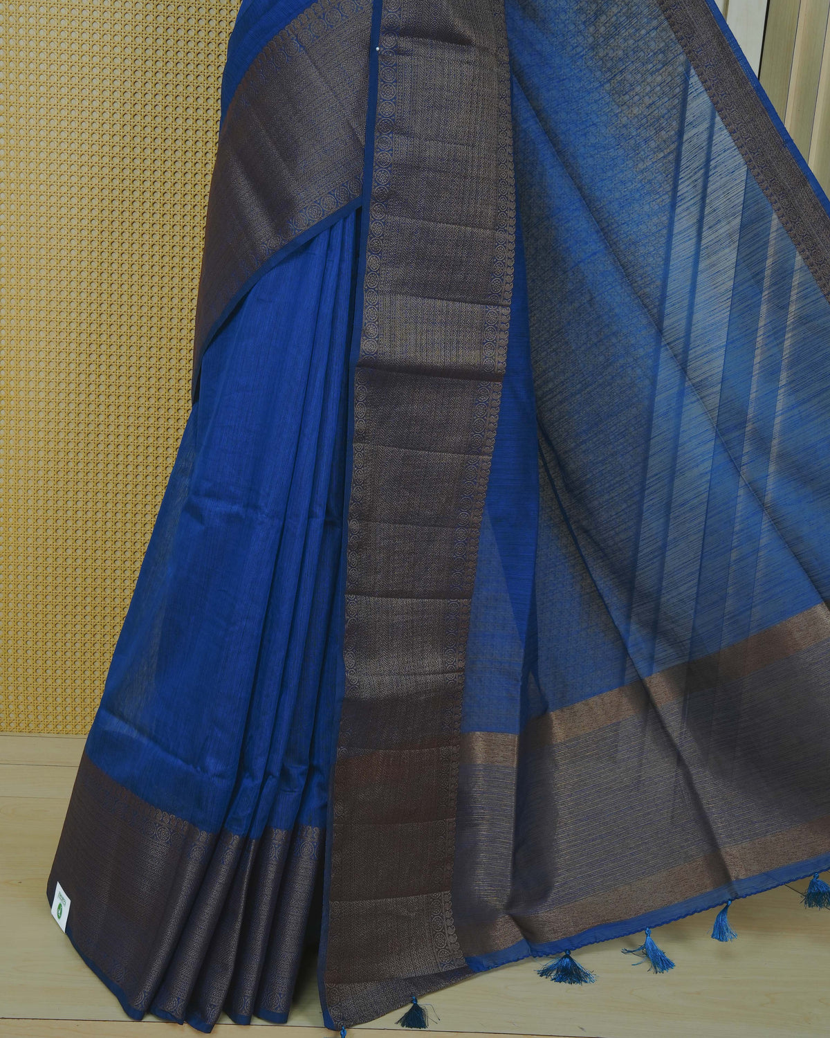 Blue colour semi linen saree plain body, contrast self colour gold zari detailed border, grand pallu comes with matching blouse piece