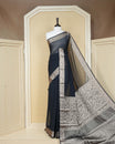Black colour georgette saree having plain body, peacock & deer gold zari detailed border, comes with matching blouse piece