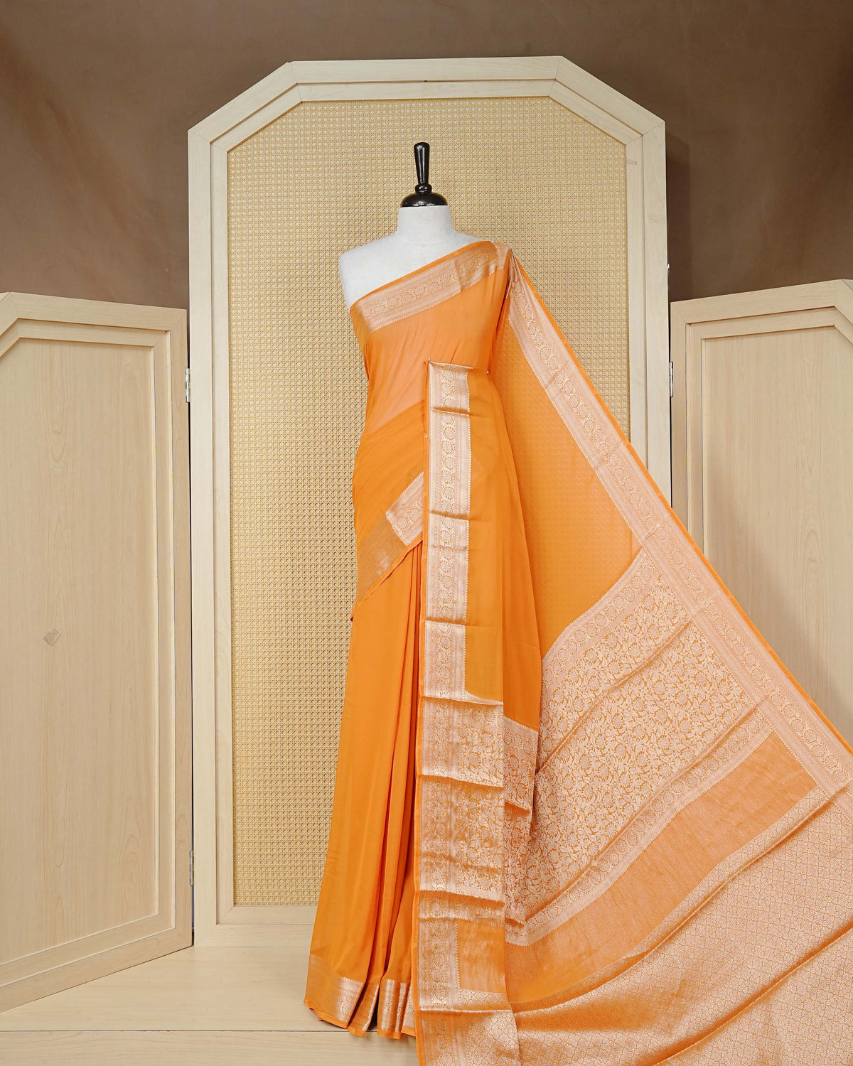 Orange colour georgette saree having plain boy, Floral Gold zari detailed pattern border, comes with matching blouse piece