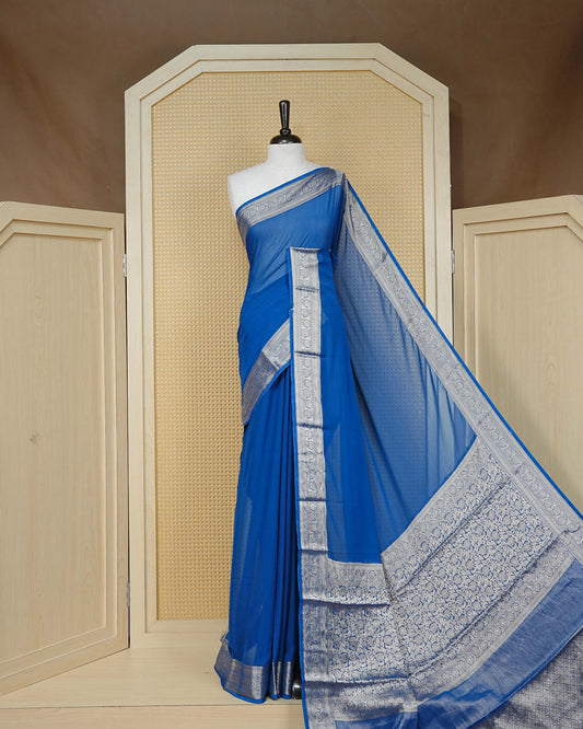Royal blue colour georgette saree having plain boy, Floral Gold zari detailed pattern border, comes with matching blouse piece