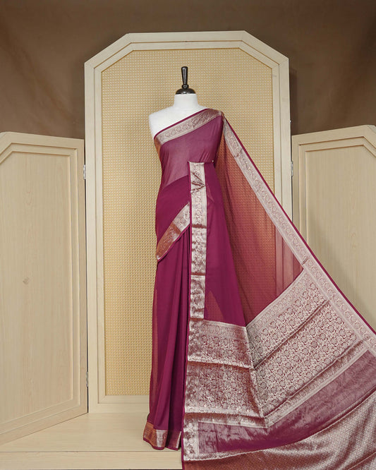 Wine colour georgette saree having plain boy, Floral Gold zari detailed pattern border, comes with matching blouse piece