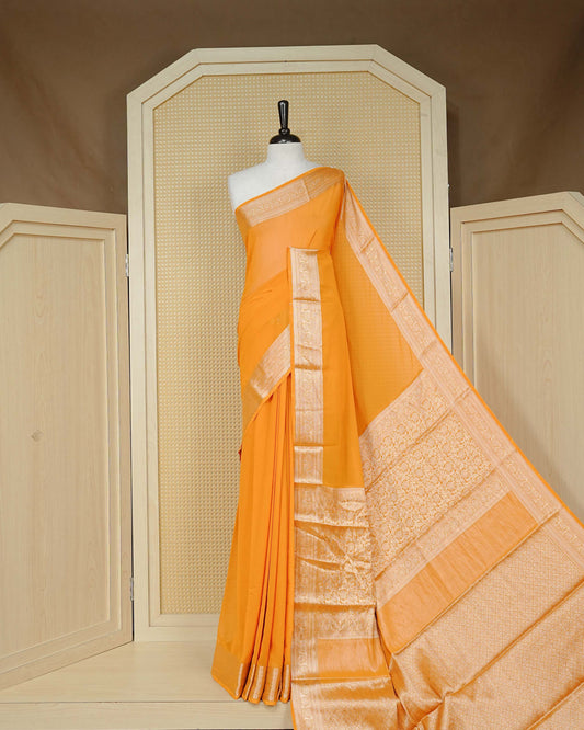 Yellow colour georgette saree having plain boy, Floral Gold zari detailed pattern border, comes with matching blouse piece