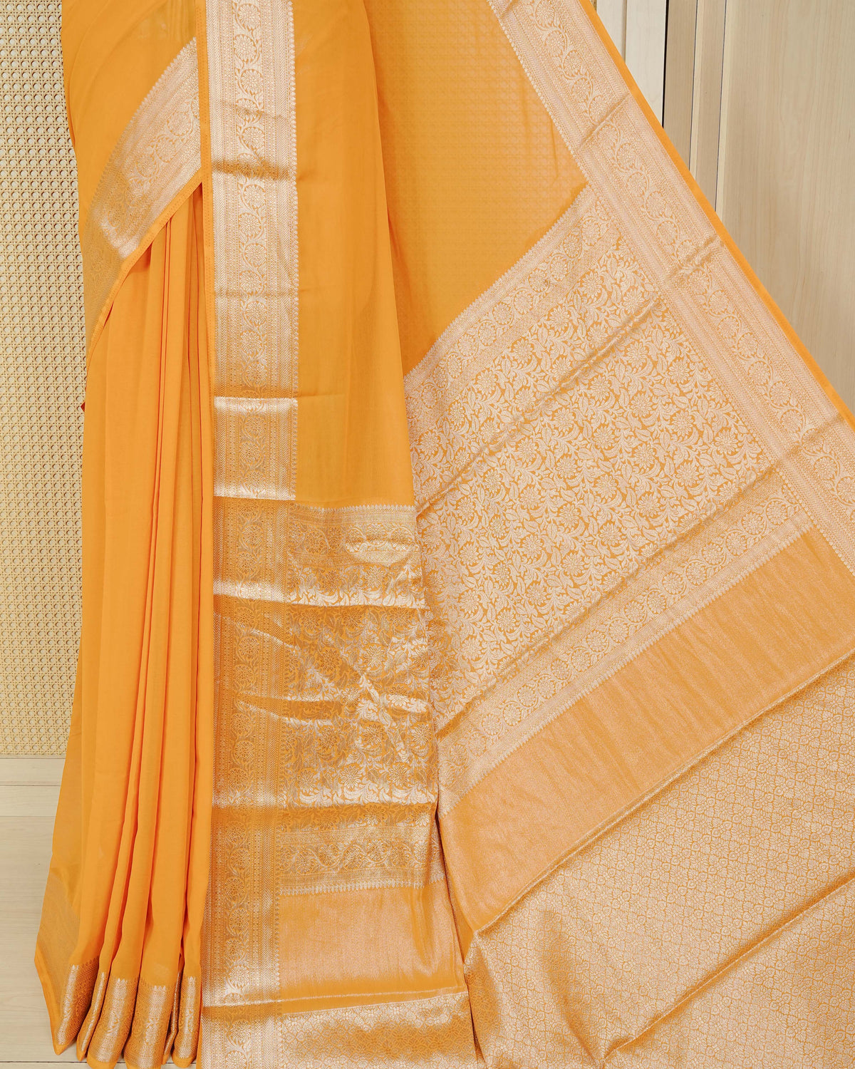 Yellow colour georgette saree having plain boy, Floral Gold zari detailed pattern border, comes with matching blouse piece