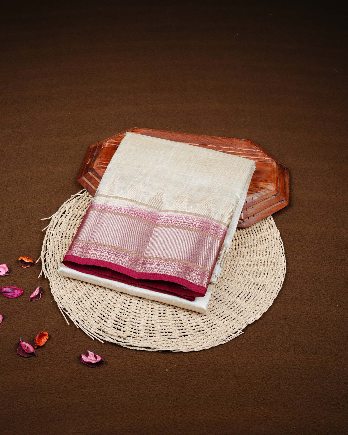 Cream colour Tussar silk saree Featuring Plain body, complemented by Contrast maroon colour gold zari temple & zari border, paired with matching blouse piece.