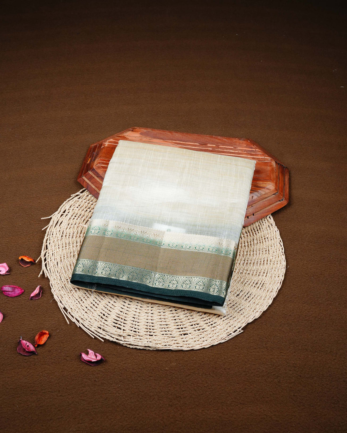 Cream colour Tussar silk saree Featuring Plain body, complemented by Contrast dark green colour double border with zari detailing, paired with matching blouse piece.