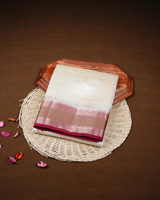 Cream colour Tussar silk saree Featuring Plain body, complemented by Contrast dark maroon colour double border with zari detailing, paired with matching blouse piece.
