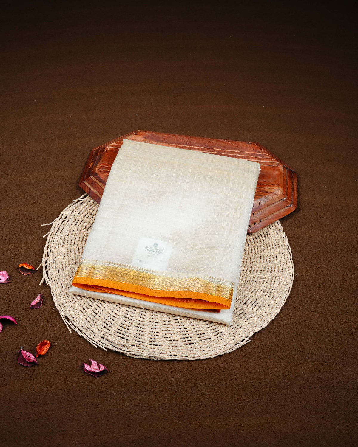 Cream colour Tussar silk saree Featuring Plain body, complemented by Contrast mustard colour gold zari border, paired with matching blouse piece.