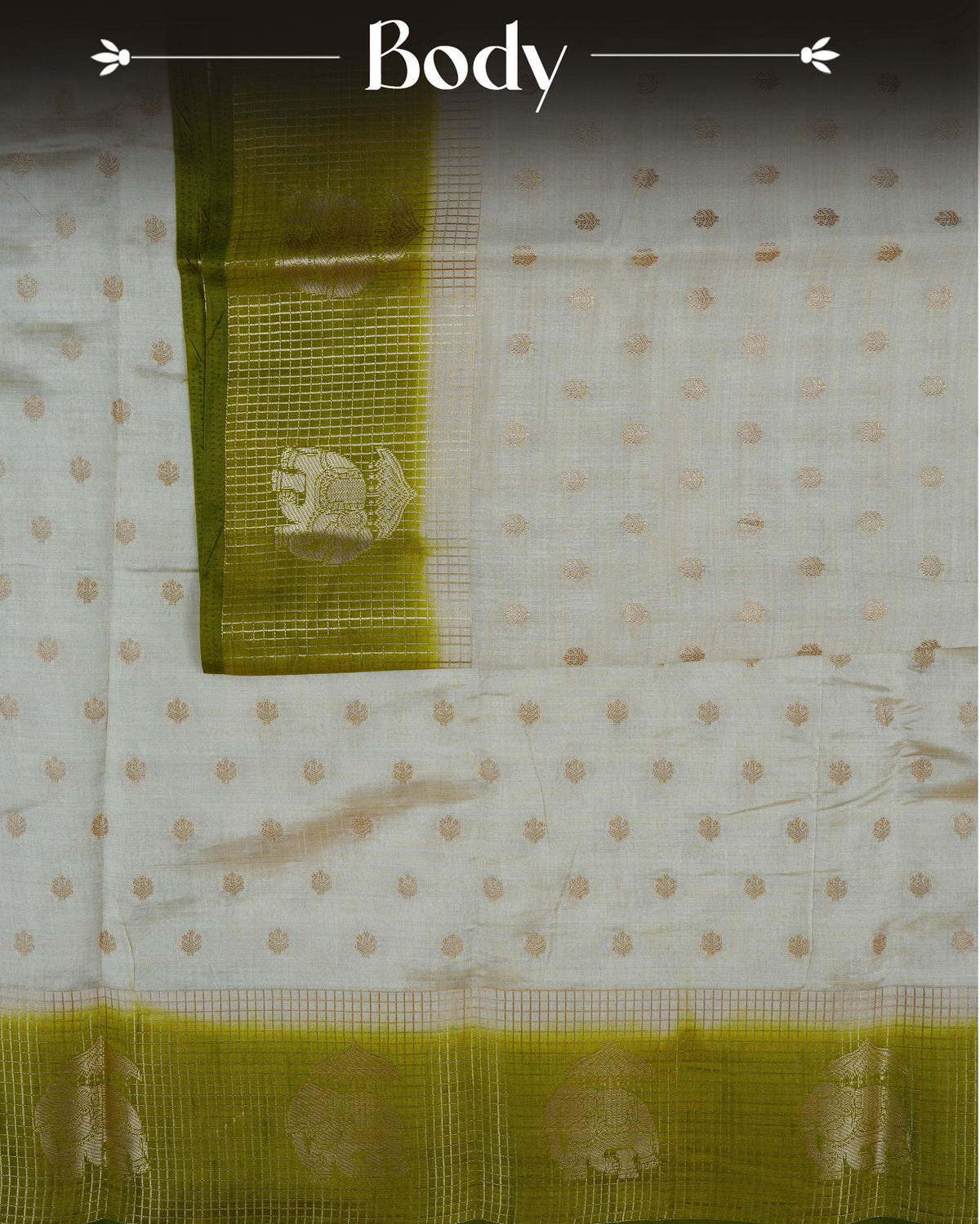 Cream colour Tussar silk saree Featuring buttas on body, complemented by Contrast olive green colour gold zari check pattern with elephant motifs on border, paired with matching blouse piece.
