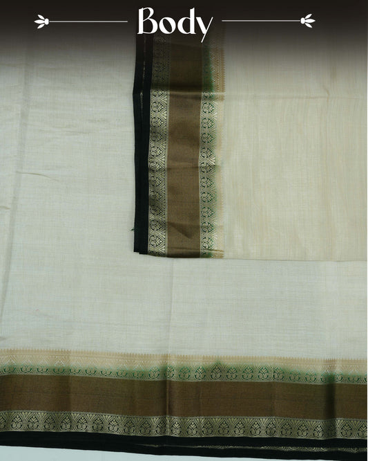 Cream colour Tussar silk saree Featuring Plain body, complemented by Contrast dark green colour double border with zari detailing, paired with matching blouse piece.