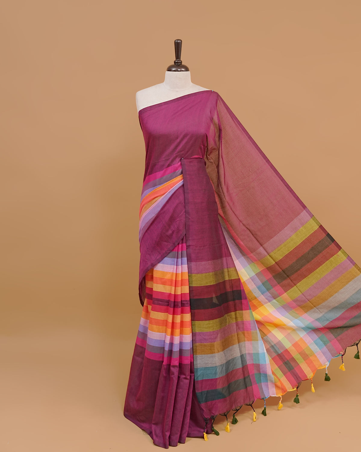 Wine Colour Mul Cotton Saree Featuring Plain body. With out Border Golden Strips on pallu comes With Black Tassels
