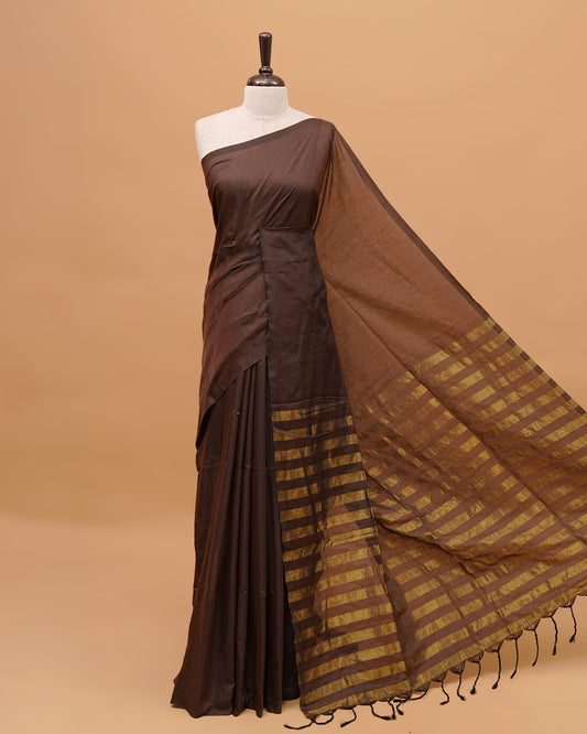 Brown Colour Mul Cotton Saree Featuring Plain body. With out Border Golden Strips on pallu comes With Tassels