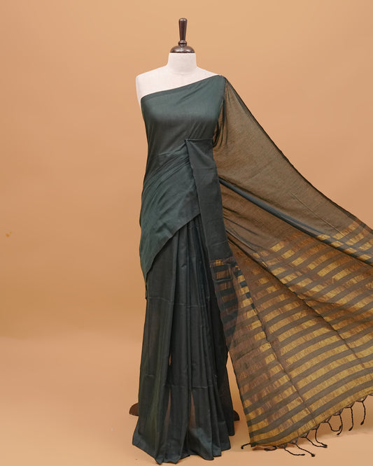 Pine Green Colour Mul Cotton Saree Featuring Plain body. With out Border Golden Strips on pallu comes With Tassels