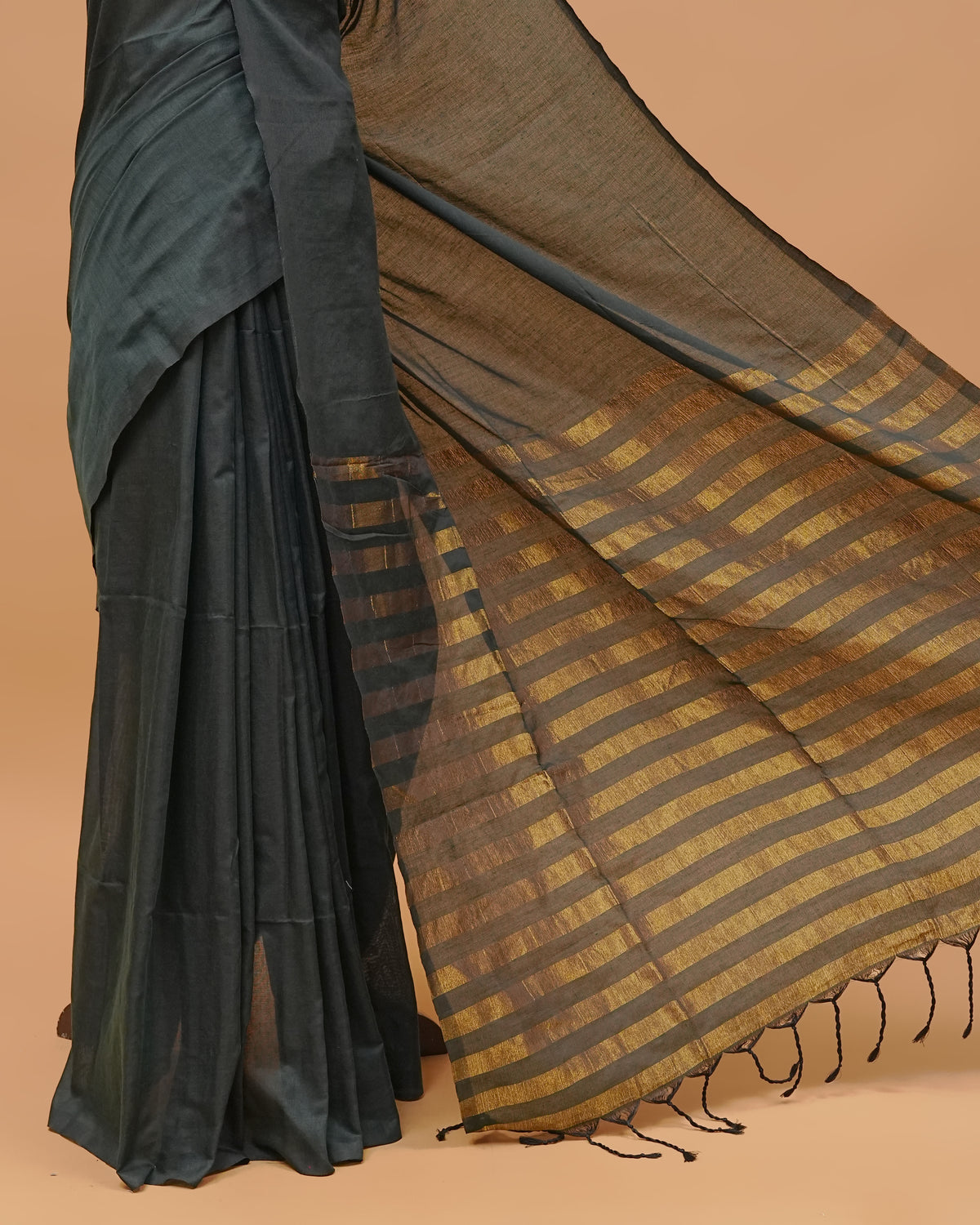 Pine Green Colour Mul Cotton Saree Featuring Plain body. With out Border Golden Strips on pallu comes With Tassels