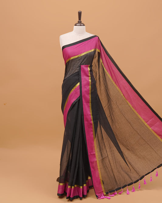 Black Colour Mul Cotton Saree Featuring Plain body. With Contrast Gold and Majendha Border, pallu comes With Tassels