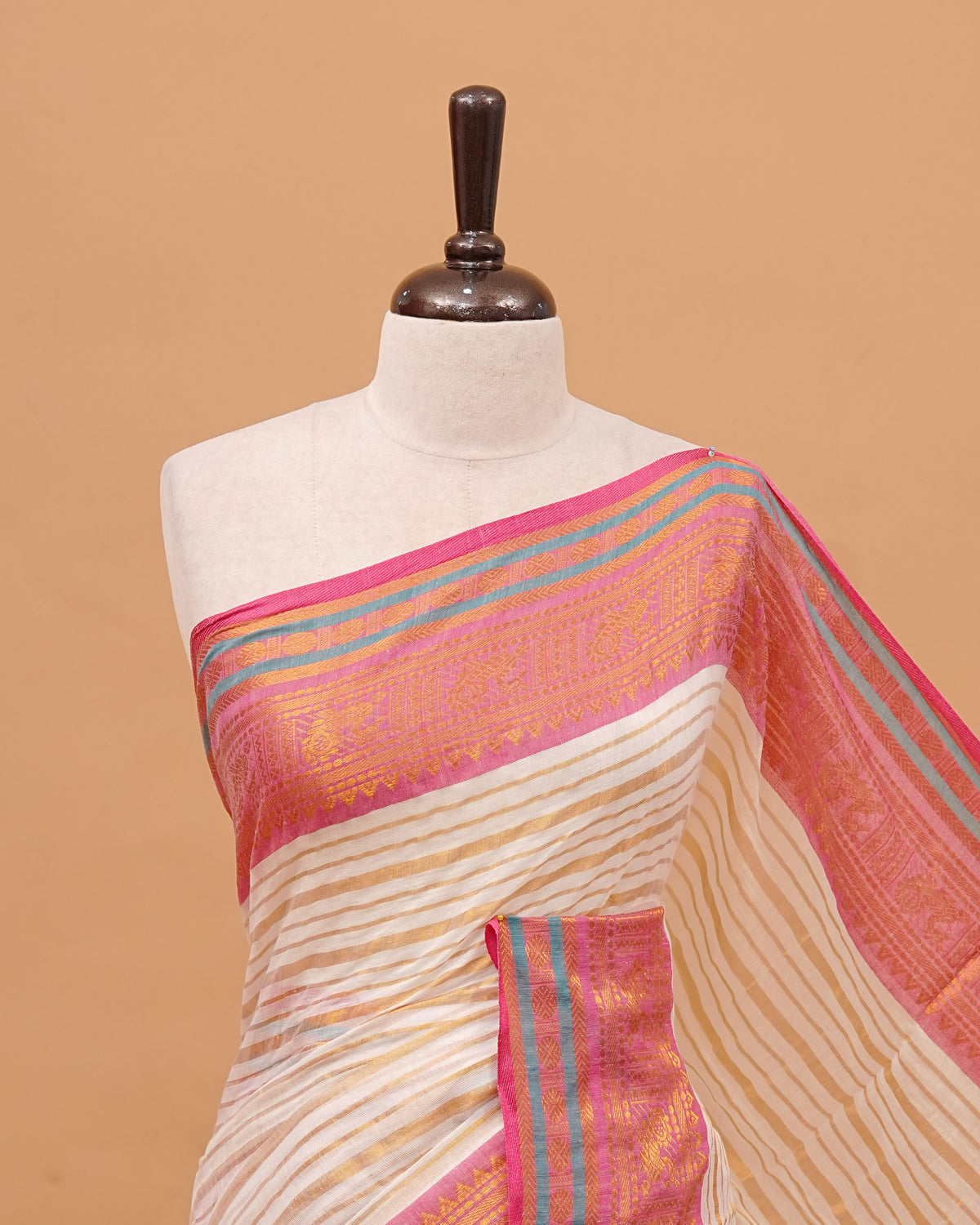 White Colour Mul Cotton Saree Featuring Plain body. With out Border Golden Strips on pallu comes With Tassels