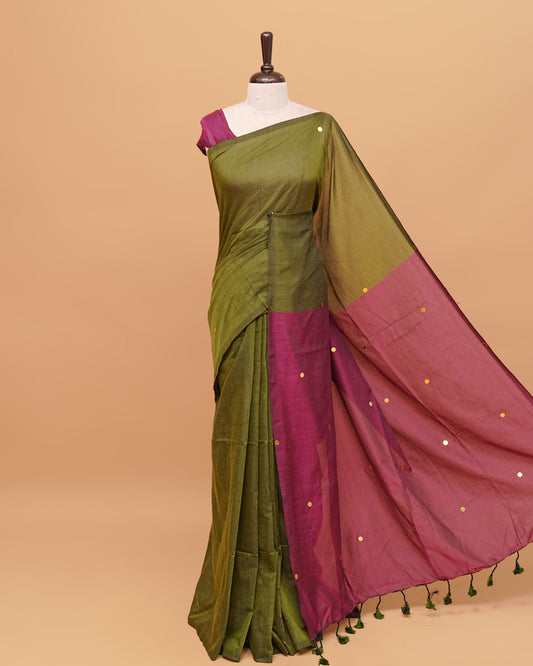 Olive and wine coloured half and half mul cotton saree featuring elegant sequin detailing on the body, finished with a beautiful pallu adorned with tassels.