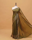 Dark Olive colour semi silk saree featuring elegant foil checks on the body, complemented by a grand border and a beautiful pallu adorned with tassels.