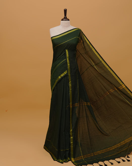 Dark Green Colour Mul Cotton Saree Featuring Plain body. Gold zari Border & Golden Strips on pallu comes With Tassels