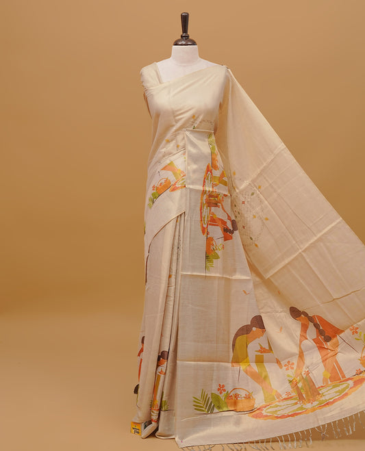Cream colour semi tissue saree featuring Kerala traditional Festival prints on the body, without a border & pallu . Paired with a matching blouse piece.
