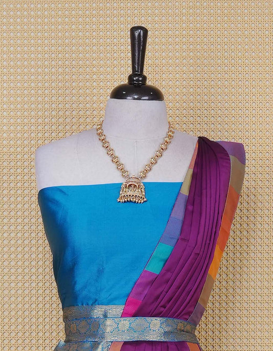 Peacock Blue colour Semi Silk Semi stitched dhavani set featuring a Plain body with a matching Multi colour with gold zari bordered skirt & blouse piece and dupatta.