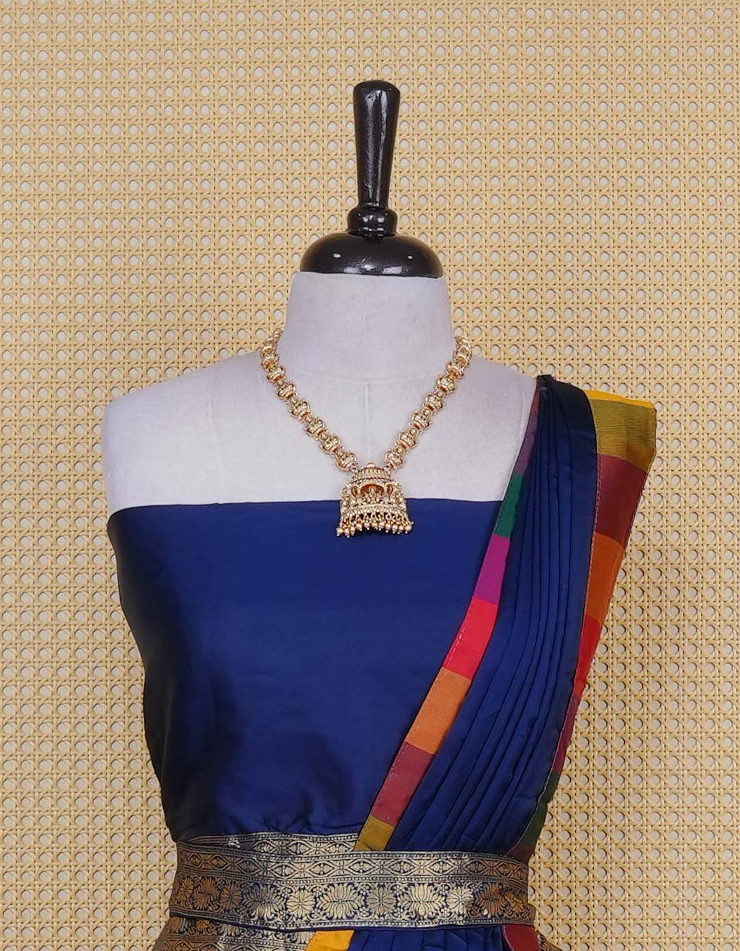Navy blue colour Semi Silk Semi stitched dhavani set featuring a Plain body with a matching Multi colour with gold zari bordered skirt & blouse piece and dupatta.