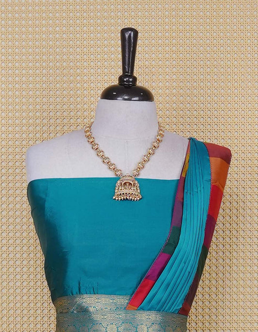 Peacock Green colour Semi Silk Semi stitched dhavani set featuring a Plain body with a matching Multi colour with gold zari bordered skirt & blouse piece and dupatta.