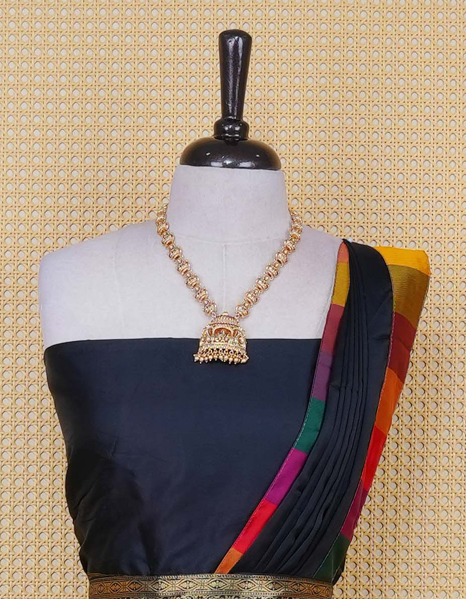 Black colour Semi Silk Semi stitched dhavani set featuring a Plain body with a matching Multi colour with gold zari bordered skirt & blouse piece and dupatta.