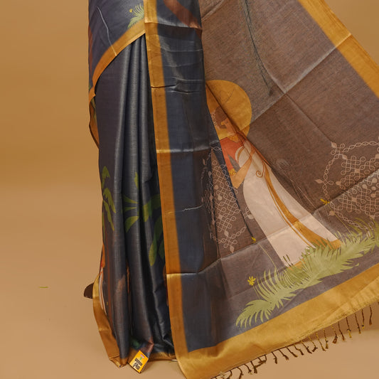 Grayish blue colour semi tissue saree featuring a Lady prints on the body, with gold colour border & pallu finished with tassels. Paired with a matching blouse piece.