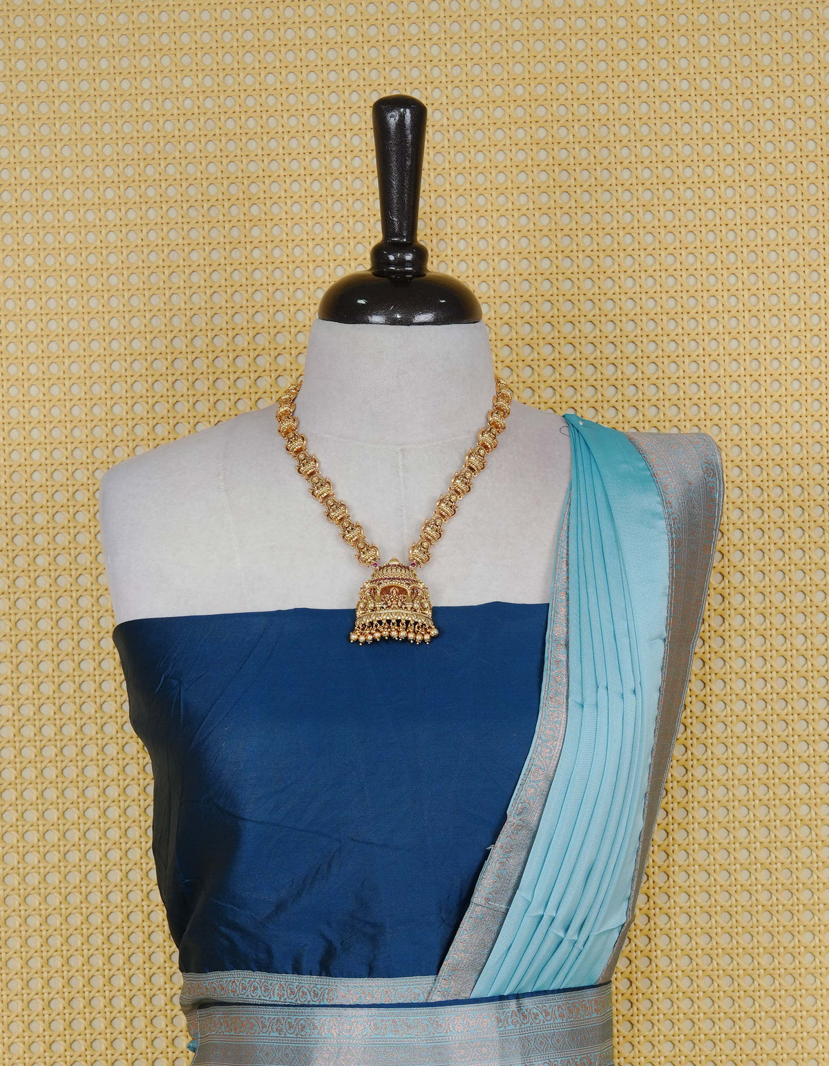 Navy Blue colour Semi Silk Semi stitched dhavani set featuring a Plain body with a matching contrast Sky blue colour with copper zari bordered skirt & blouse piece and dupatta.