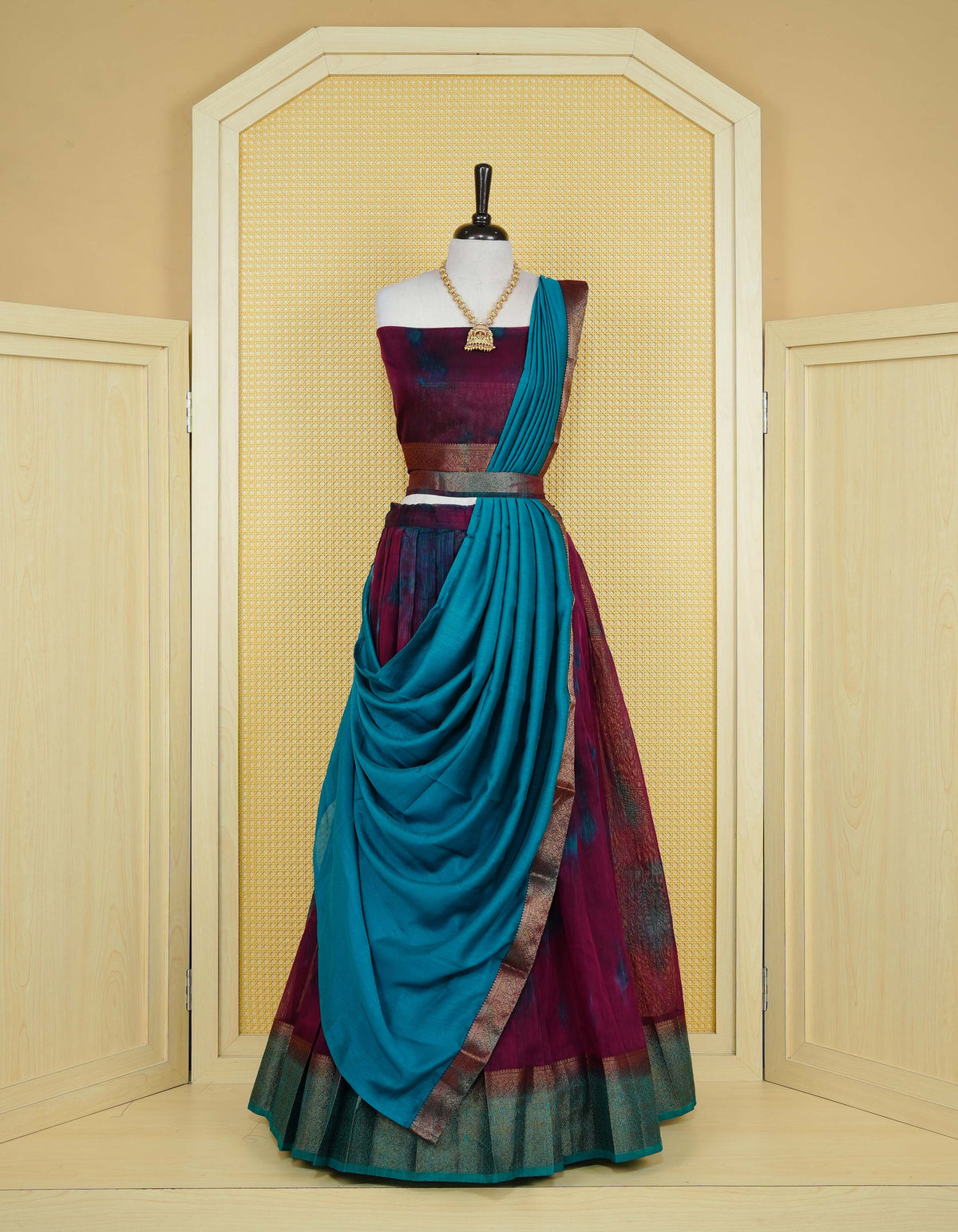 Wine colour semi linen Semi Stitched dhavani set Featuring Teal Colour Ombre shaded Body & contrast Teal Green Colour Border with Gold zari Details on skirt, Contrast Blouse piece & matching dupatta.