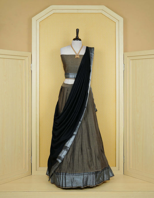 Khaki Grey colour Chettinad Semi Stitched dhavani set Featuring contrast Black Colour with Silver zari border on skirt, Contrast Blouse piece & matching dupatta.