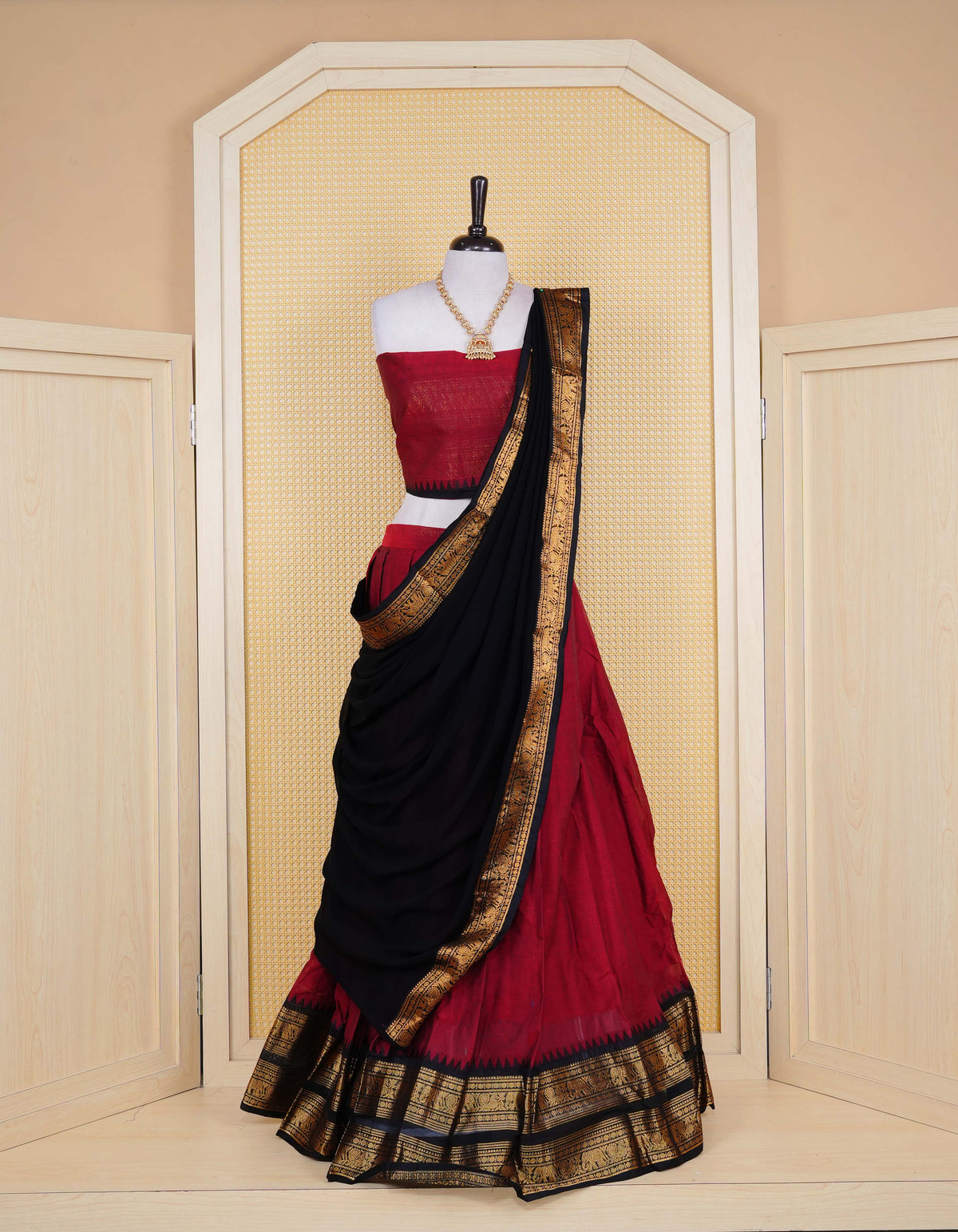 Brick Red colour Chettinad Semi Stitched dhavani set Featuring contrast Black colour with Gold zari border on skirt, Contrast Blouse piece & matching dupatta.