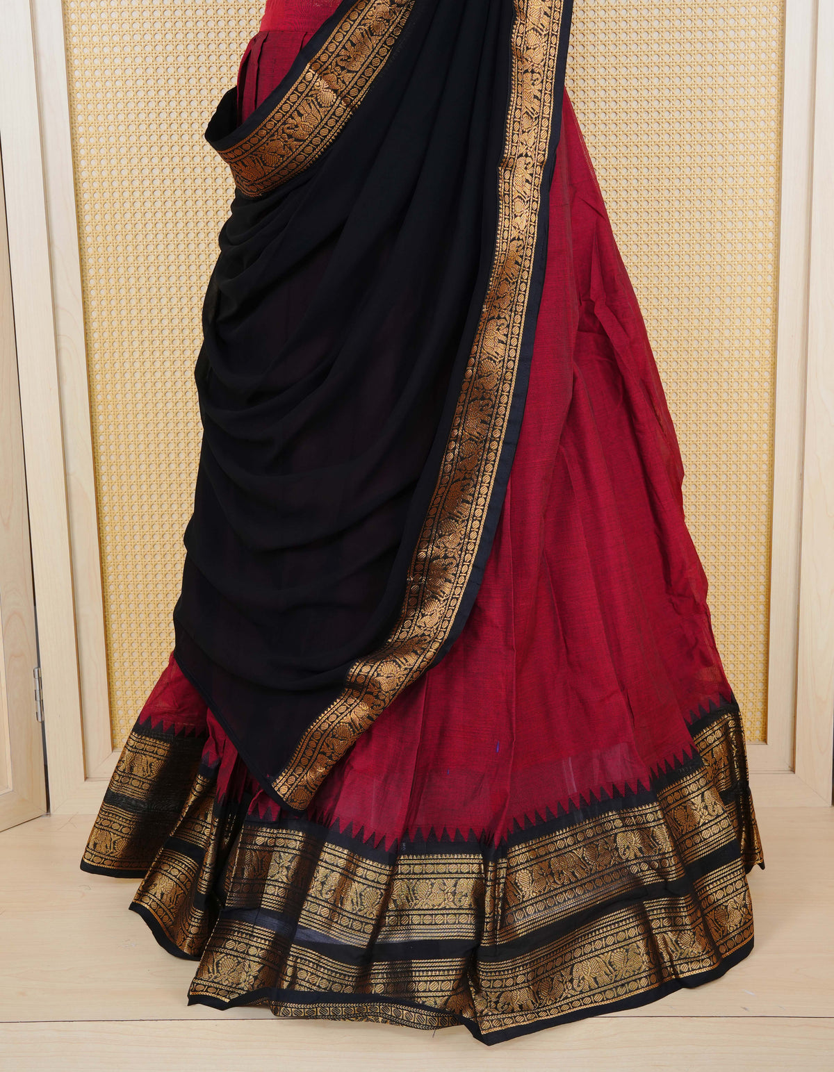 Brick Red colour Chettinad Semi Stitched dhavani set Featuring contrast Black colour with Gold zari border on skirt, Contrast Blouse piece & matching dupatta.