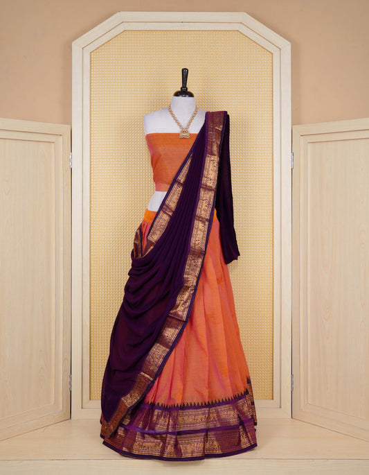 Rust Orange colour Chettinad Semi Stitched dhavani set Featuring contrast Purple colour with Gold zari border on skirt, Contrast Blouse piece & matching dupatta.