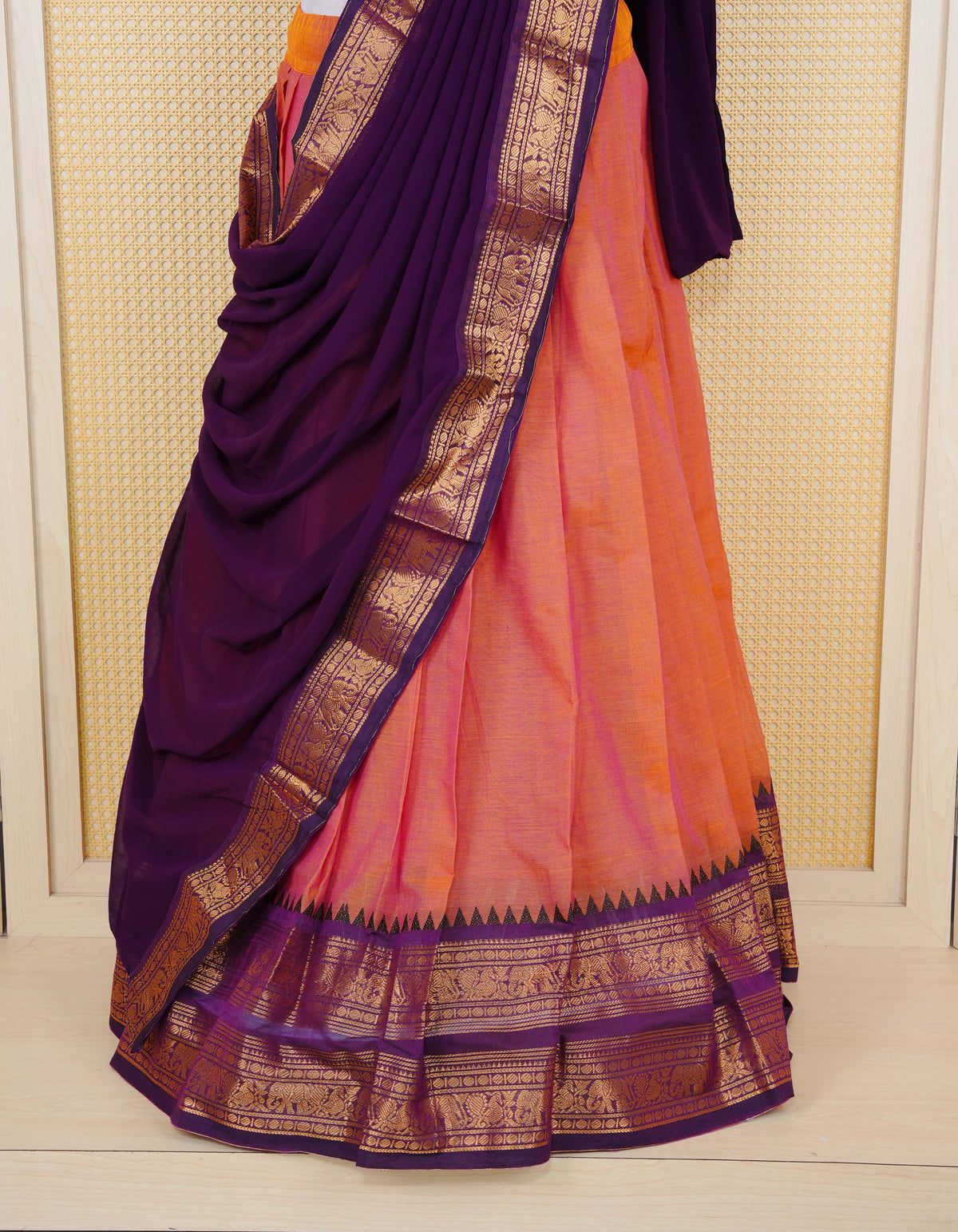 Rust Orange colour Chettinad Semi Stitched dhavani set Featuring contrast Purple colour with Gold zari border on skirt, Contrast Blouse piece & matching dupatta.
