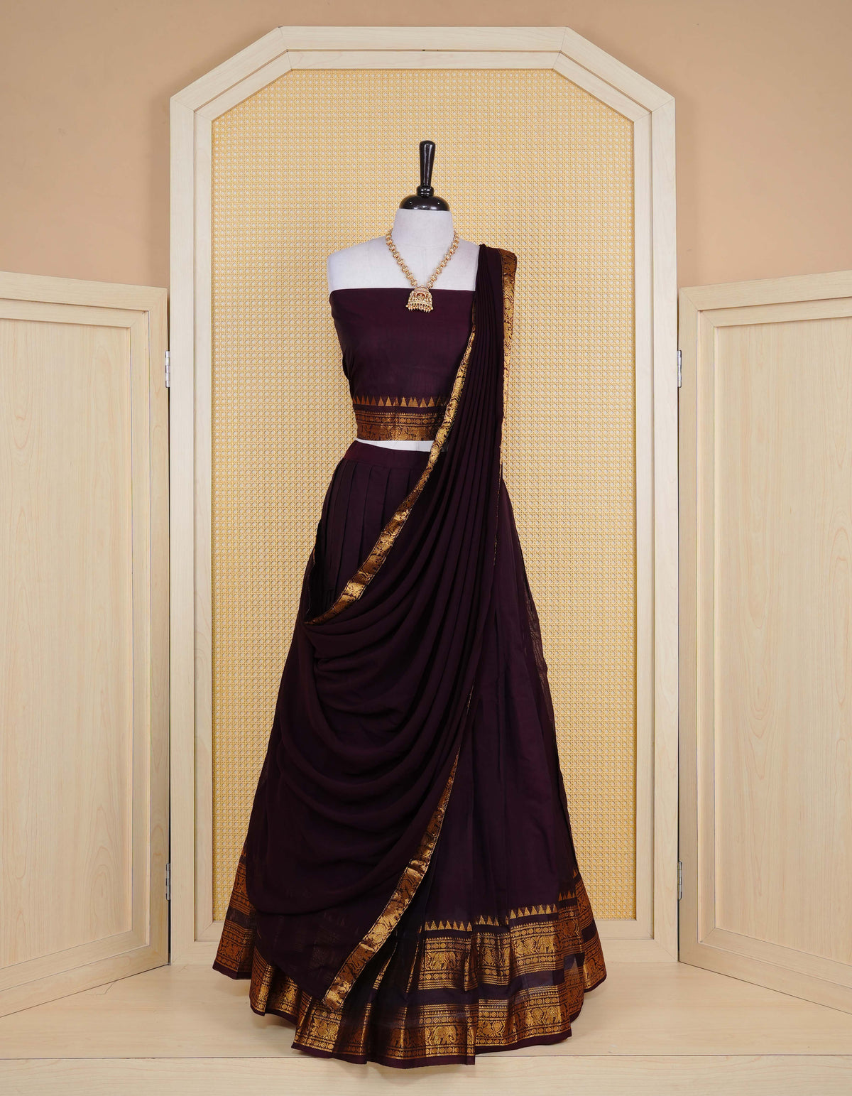 Dark Chocolate brown colour Chettinad Semi Stitched dhavani set Featuring contrast self colour with Gold zari border on skirt, Contrast Blouse piece & matching dupatta.