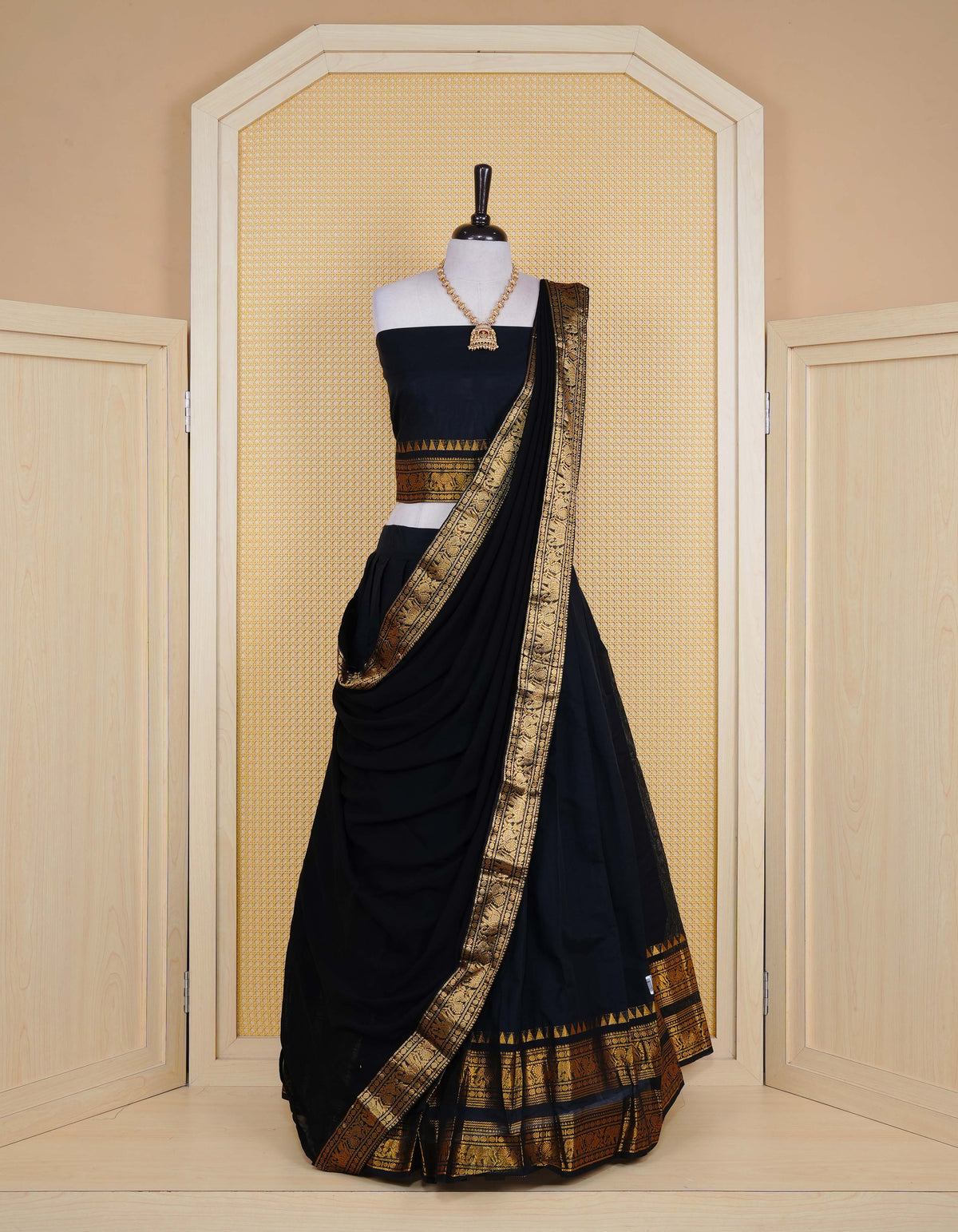 Black colour Chettinad Semi Stitched dhavani set Featuring contrast self colour with Gold zari border on skirt, Contrast Blouse piece & matching dupatta.