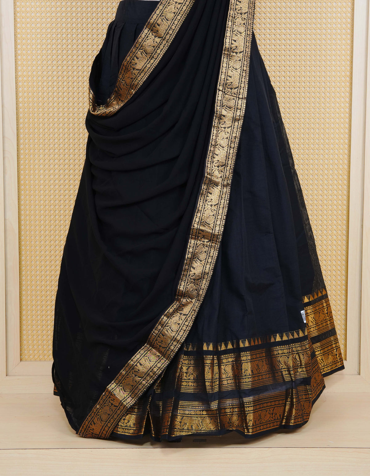 Black colour Chettinad Semi Stitched dhavani set Featuring contrast self colour with Gold zari border on skirt, Contrast Blouse piece & matching dupatta.
